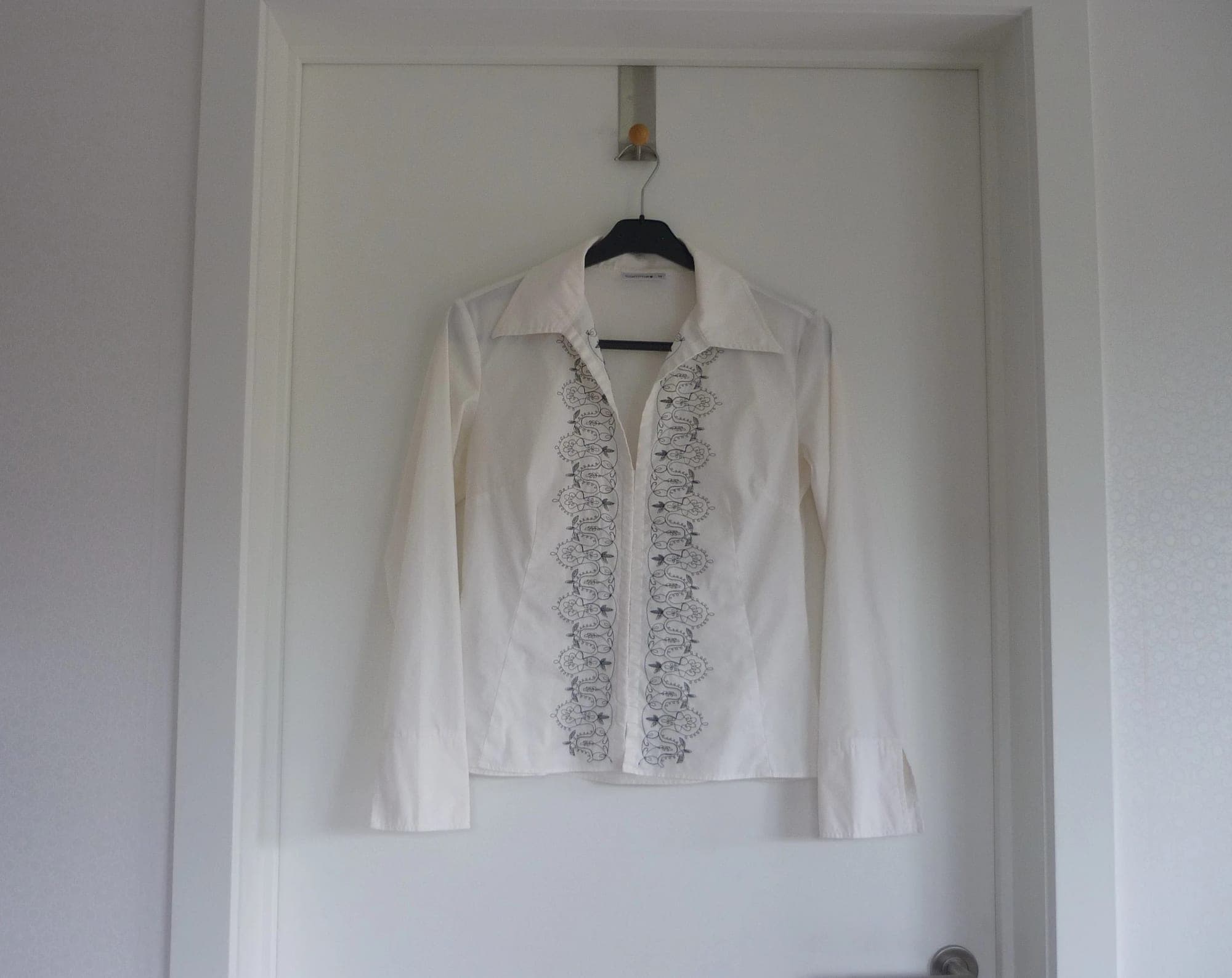 Broken white shirt with black stitching and corset closure by Comma Size 36