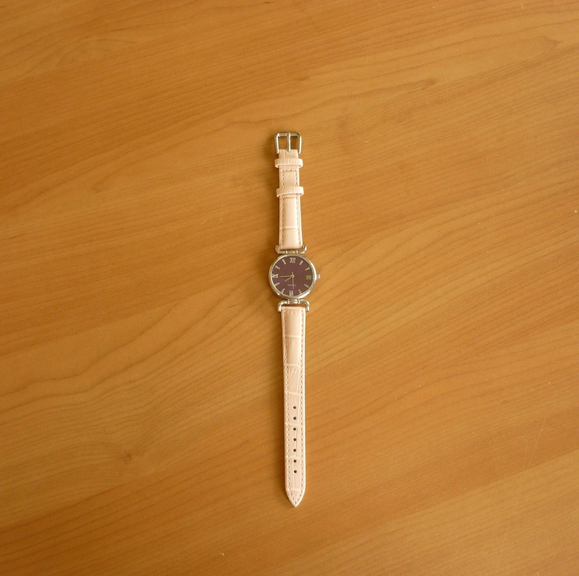 Paars horloge met pastelroze horlogeband