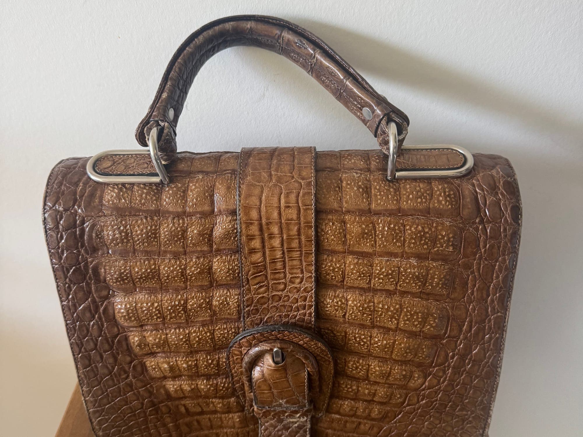 Brown crocodile embossed leather handbag with handle