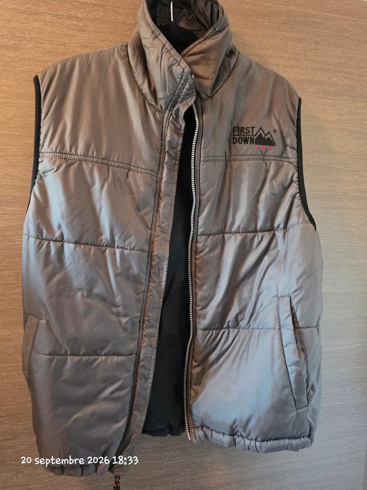 Uniseks reversible mouwloos dons vest