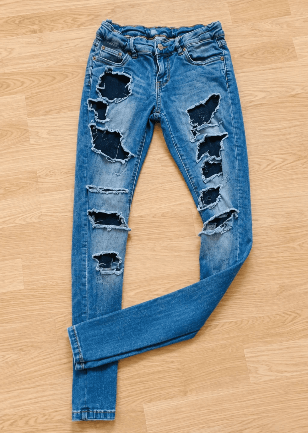 Blauwe skinny jeans medium met scheuren