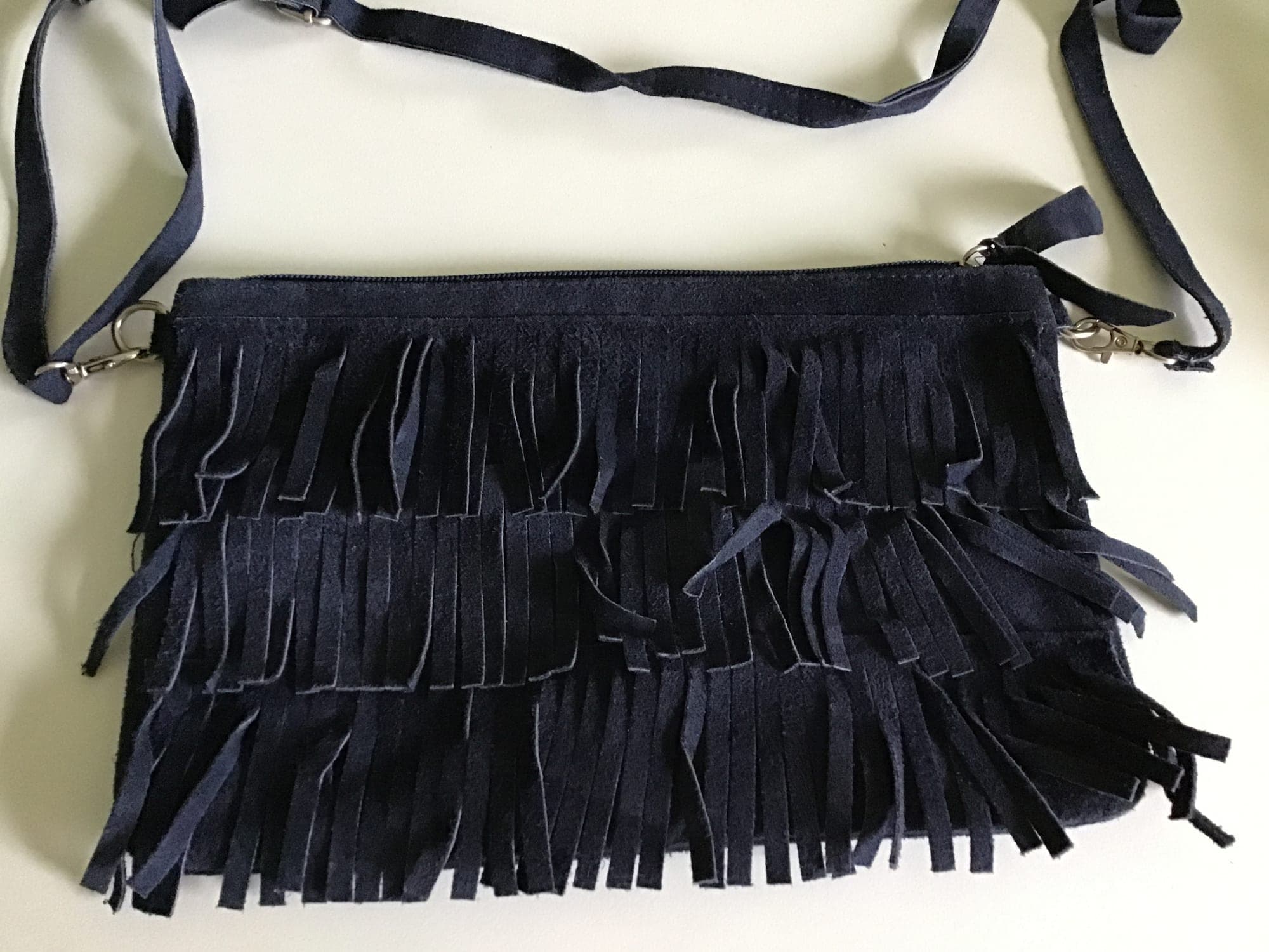 Black shoulder bag with fringe and leather details