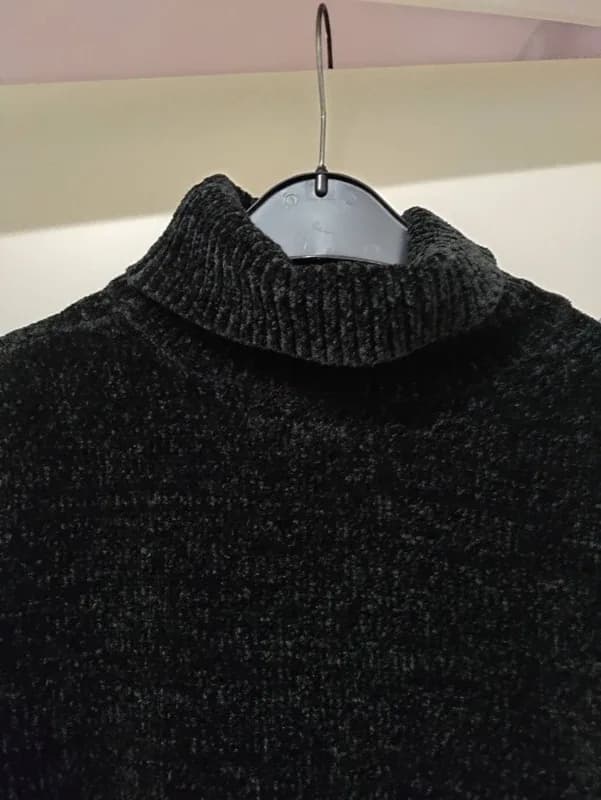 Zwart melange coltrui met textuurpatroon